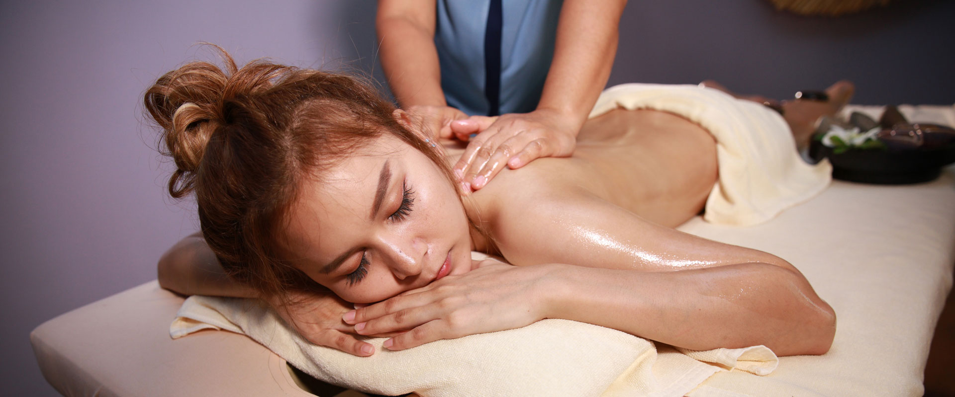 hands doing massage for a lady